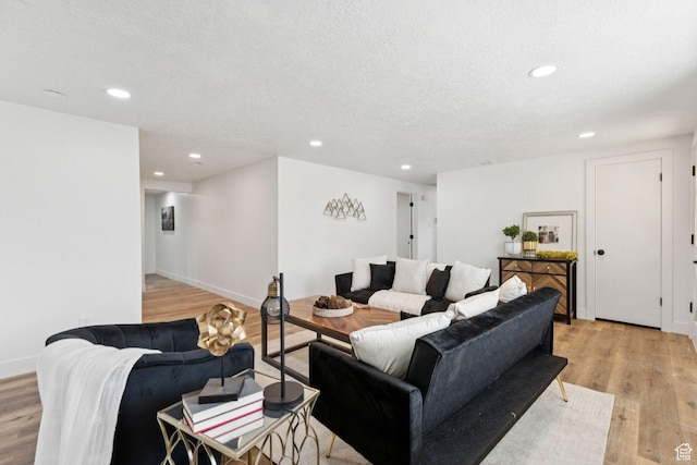 147 E 1700 S, Orem, UT 84058 - living area with light wood finished floors, recessed lighting, and a textured ceiling