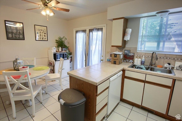 1714 E 5825 S, South Ogden, UT 84403 - kitchen with stainless steel microwave, dishwasher, plenty of natural light, and a peninsula