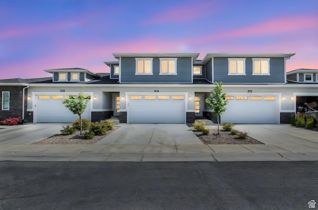 1371 W Stewart Falls Dr, Riverton, UT 84065 - view of front of house with stone siding, concrete driveway, and a garage