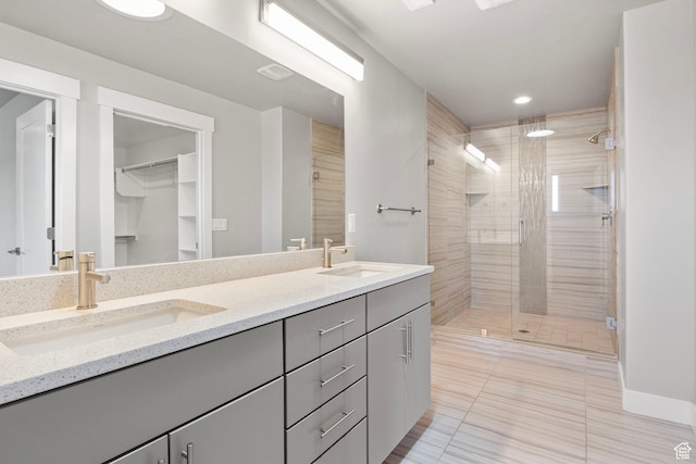 1371 W Stewart Falls Dr, Riverton, UT 84065 - full bath featuring double vanity, a shower stall, tile patterned flooring, a spacious closet, and recessed lighting