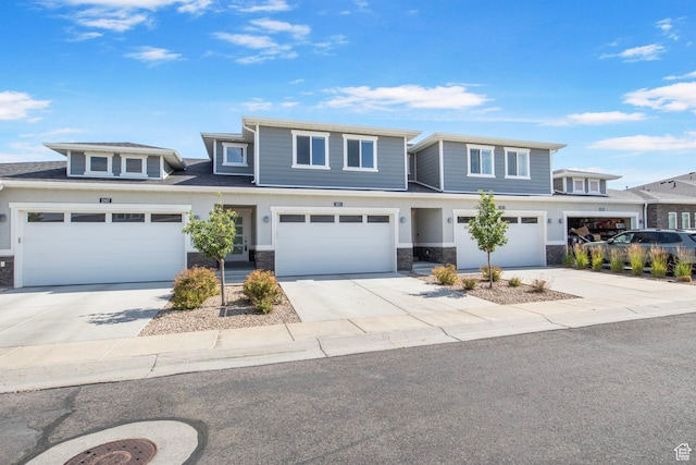 1371 W Stewart Falls Dr, Riverton, UT 84065 - view of front of property featuring stone siding, concrete driveway, and a garage
