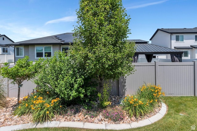 6462 W Shawnee Marie Way, Herriman, UT 84096 - view of home's exterior featuring a standing seam roof, a gazebo, a metal roof, and stucco siding