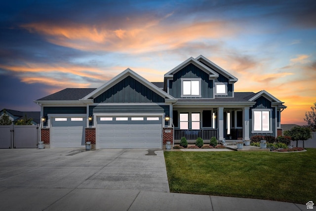 6462 W Shawnee Marie Way, Herriman, UT 84096 - craftsman-style home featuring covered porch, an attached garage, board and batten siding, driveway, and a gate