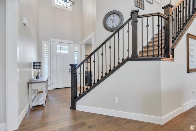 6462 W Shawnee Marie Way, Herriman, UT 84096 - entryway with a towering ceiling, stairway, and wood finished floors