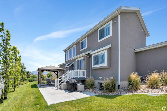 6462 W Shawnee Marie Way, Herriman, UT 84096 - rear view of property with a gazebo, a patio area, stucco siding, and a lawn