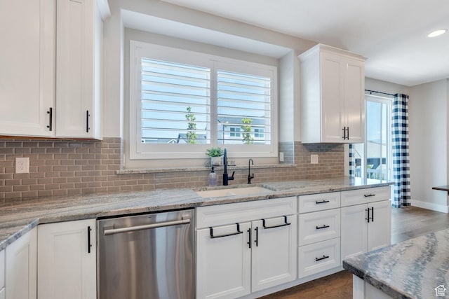 6462 W Shawnee Marie Way, Herriman, UT 84096 - kitchen featuring dishwasher, wood finished floors, white cabinetry, tasteful backsplash, and light stone counters