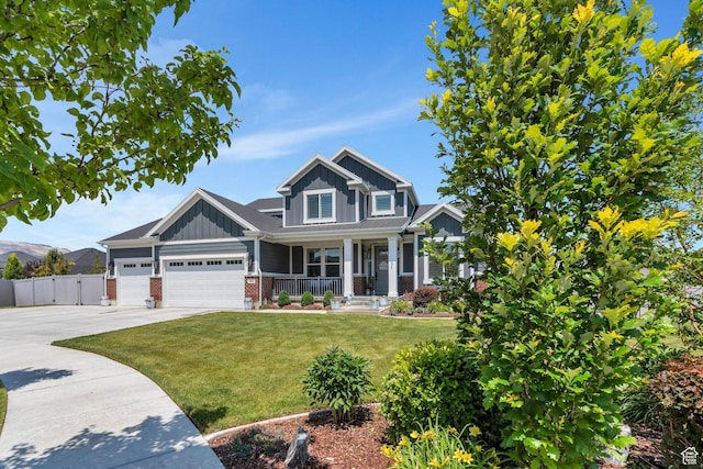 6462 W Shawnee Marie Way, Herriman, UT 84096 - craftsman-style home featuring covered porch, board and batten siding, driveway, brick siding, and a garage