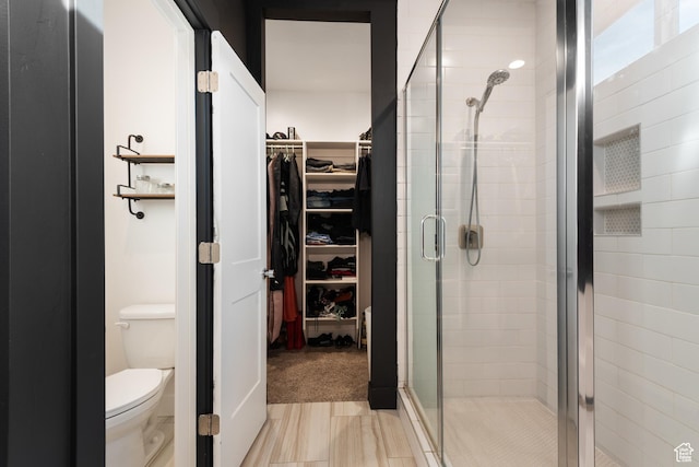 5057 N Foxtail W, Eagle Mountain, UT 84005 - bathroom featuring a walk in closet and a stall shower