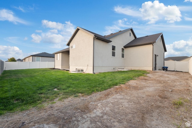 5057 N Foxtail W, Eagle Mountain, UT 84005 - rear view of house with a fenced backyard and stucco siding