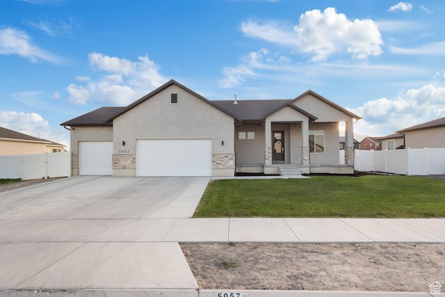 5057 N Foxtail W, Eagle Mountain, UT 84005 - view of front facade with an attached garage, stone siding, driveway, stucco siding, and a porch