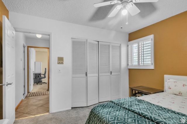 1876 E Casino Way S, Murray, UT 84121 - bedroom featuring a closet, a textured ceiling, carpet flooring, a ceiling fan, and tile patterned flooring