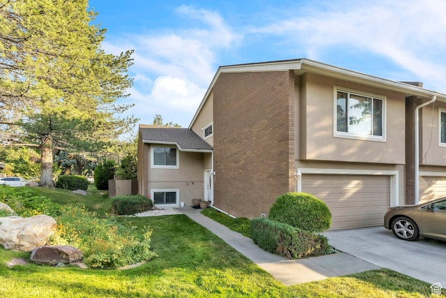 1876 E Casino Way S, Murray, UT 84121 - view of home's exterior with stucco siding, a garage, concrete driveway, and a lawn