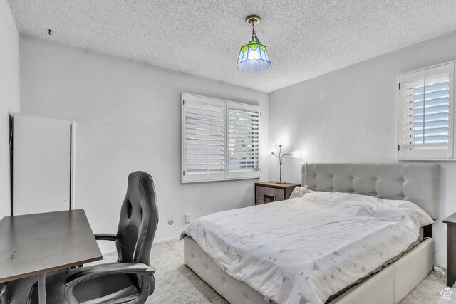 1876 E Casino Way S, Murray, UT 84121 - carpeted bedroom featuring a textured ceiling, multiple windows, and a desk