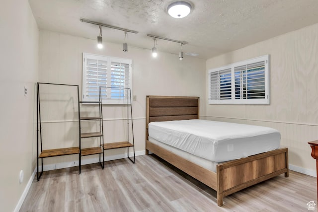 1876 E Casino Way S, Murray, UT 84121 - bedroom with wood finished floors and track lighting