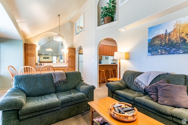 2100 Canyons Resort Dr Unit 21C, Park City, UT 84098 - living room featuring arched walkways, light carpet, and a towering ceiling