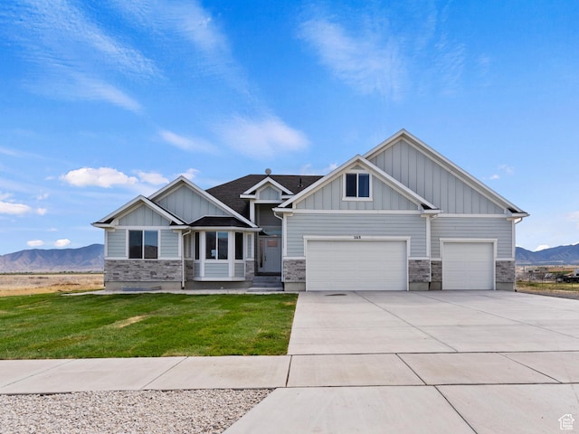 269 Cook Ln, Grantsville, UT 84029 - craftsman-style house with a mountain view, board and batten siding, driveway, stone siding, and a front lawn