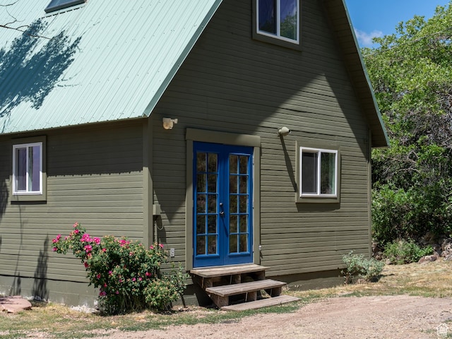 4410 S Upper Aspen Loop Unit 130, Kamas, UT 84036 - view of home's exterior featuring french doors, entry steps, and a metal roof