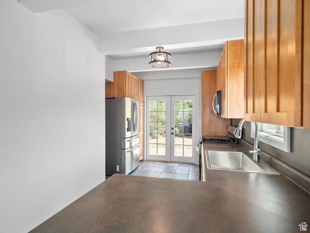 4410 S Upper Aspen Loop Unit 130, Kamas, UT 84036 - kitchen featuring stainless steel appliances, french doors, dark countertops, and brown cabinetry