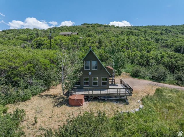 4410 S Upper Aspen Loop Unit 130, Kamas, UT 84036 - rear view of property featuring a wooded view and a wooden deck