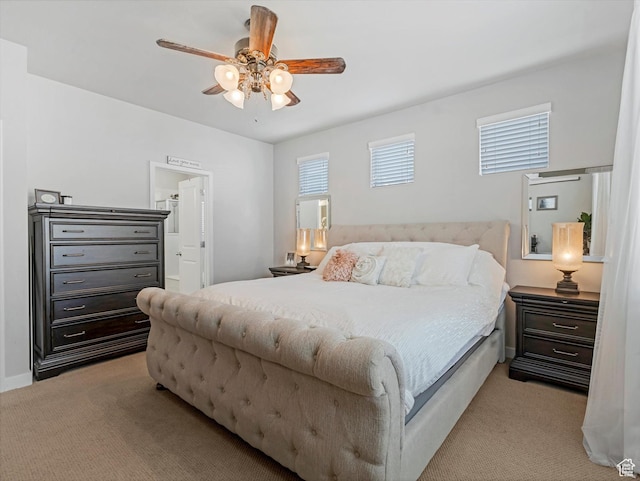 6612 W Terrace Wash Ln S Unit 119, West Jordan, UT 84081 - bedroom featuring light carpet, ensuite bath, and a ceiling fan