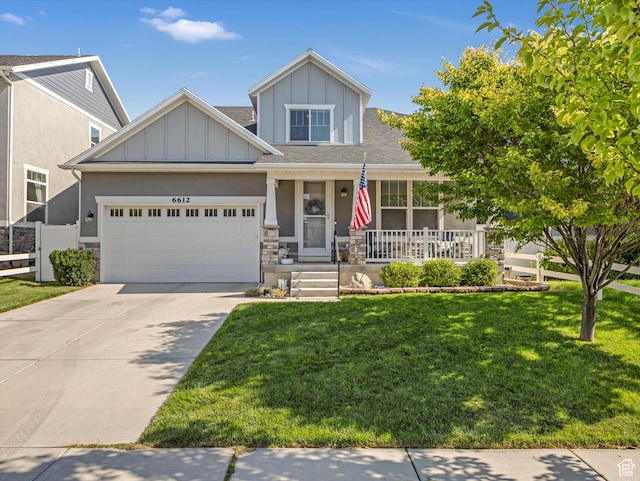 6612 W Terrace Wash Ln S Unit 119, West Jordan, UT 84081 - view of front of house with a porch, an attached garage, board and batten siding, concrete driveway, and stucco siding