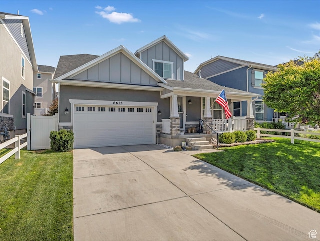 6612 W Terrace Wash Ln S Unit 119, West Jordan, UT 84081 - craftsman inspired home featuring a porch, board and batten siding, concrete driveway, an attached garage, and a shingled roof