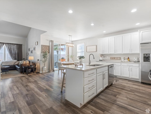 6612 W Terrace Wash Ln S Unit 119, West Jordan, UT 84081 - kitchen featuring appliances with stainless steel finishes, dark wood-style floors, light countertops, white cabinetry, and recessed lighting