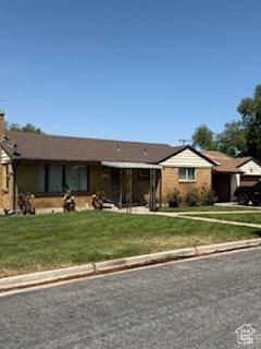 3035 Brinker Ave, Ogden, UT 84403 - ranch-style house with a front yard