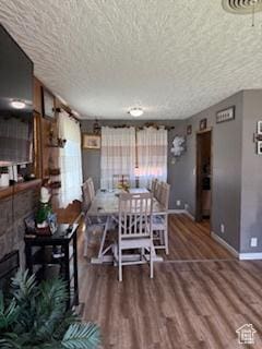 3035 Brinker Ave, Ogden, UT 84403 - dining area featuring a textured ceiling and wood finished floors