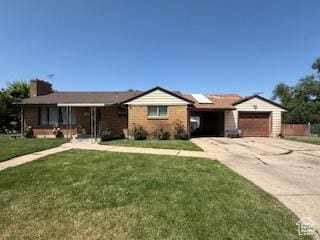 3035 Brinker Ave, Ogden, UT 84403 - single story home featuring concrete driveway, a front lawn, roof mounted solar panels, and an attached garage