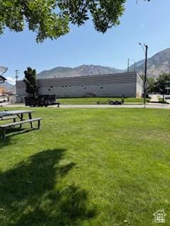 3035 Brinker Ave, Ogden, UT 84403 - surrounding community featuring a mountain view and a yard