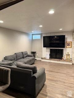 3035 Brinker Ave, Ogden, UT 84403 - living room featuring wood finished floors, recessed lighting, and a large fireplace