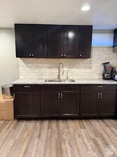 3035 Brinker Ave, Ogden, UT 84403 - bar area with light wood-type flooring and decorative backsplash