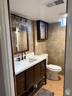 3035 Brinker Ave, Ogden, UT 84403 - bathroom with vanity, tile patterned floors, and tile walls