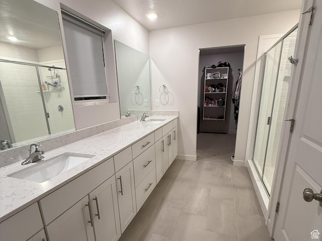 2563 N Velvet Moon Dr W Unit 625, Saratoga Springs, UT 84045 - full bath featuring a shower stall, double vanity, and a walk in closet