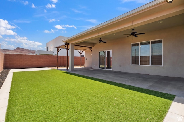 1213 E Marlowe Way, Washington, UT 84780 - fenced backyard featuring a ceiling fan and a patio