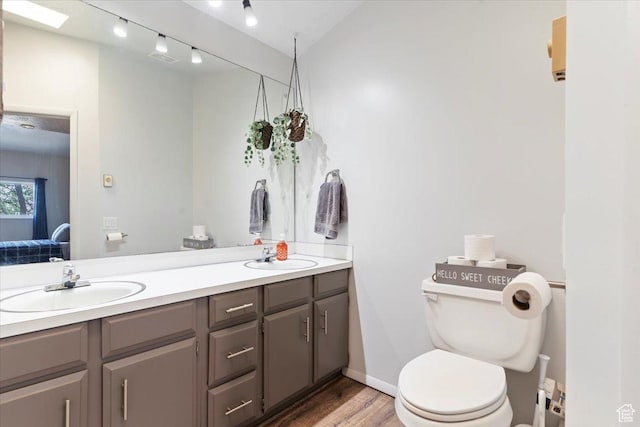 885 S 1650 E Unit B-25, Clearfield, UT 84015 - bathroom featuring double vanity and wood finished floors