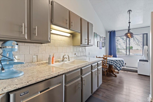 885 S 1650 E Unit B-25, Clearfield, UT 84015 - kitchen featuring dishwasher, lofted ceiling, tasteful backsplash, a baseboard heating unit, and light countertops