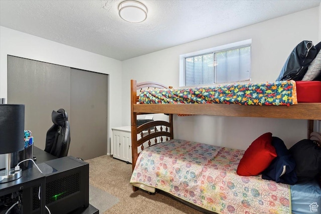 885 S 1650 E Unit B-25, Clearfield, UT 84015 - bedroom featuring carpet flooring, a desk, and a textured ceiling
