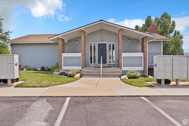 885 S 1650 E Unit B-25, Clearfield, UT 84015 - mid-century modern home featuring uncovered parking, a chimney, a front yard, and a shingled roof