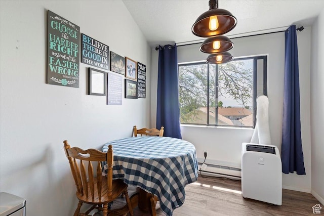 885 S 1650 E Unit B-25, Clearfield, UT 84015 - dining room featuring wood finished floors and a baseboard radiator