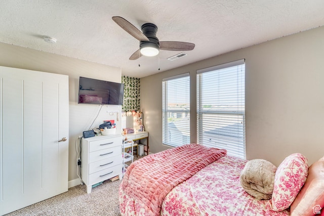 3410 W 2490 S, Hurricane, UT 84737 - bedroom featuring light carpet, a textured ceiling, and a ceiling fan