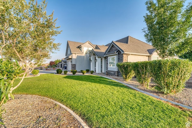 3410 W 2490 S, Hurricane, UT 84737 - view of front facade with stone siding, stucco siding, and a front lawn