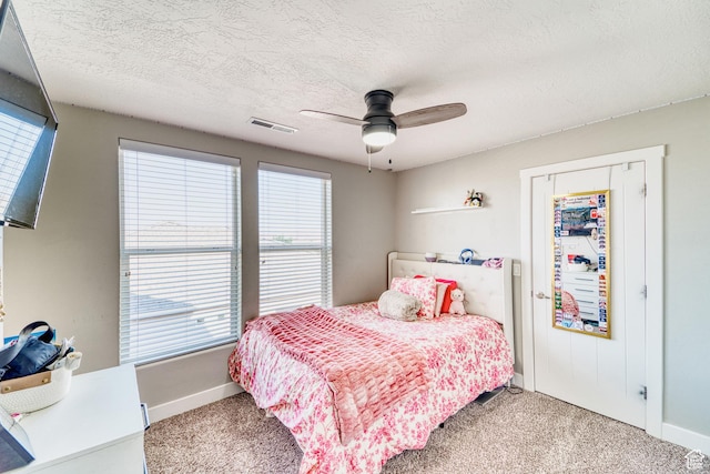 3410 W 2490 S, Hurricane, UT 84737 - carpeted bedroom with multiple windows, ceiling fan, and a textured ceiling