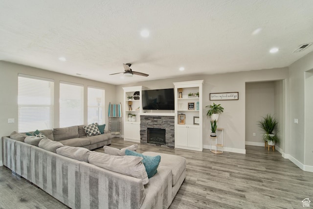 3410 W 2490 S, Hurricane, UT 84737 - living room with recessed lighting, wood finished floors, a fireplace, a ceiling fan, and a textured ceiling