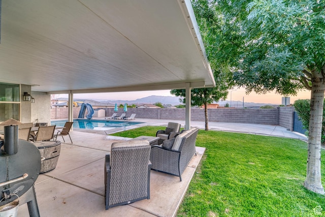 3410 W 2490 S, Hurricane, UT 84737 - patio terrace at dusk featuring a patio area, a fenced backyard, and outdoor dining area