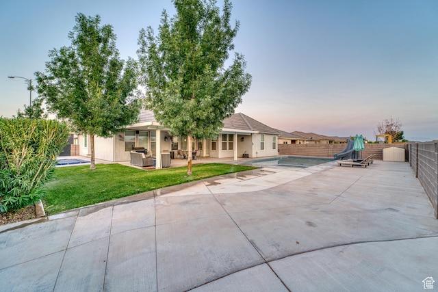 3410 W 2490 S, Hurricane, UT 84737 - back of property with a patio area, stucco siding, and outdoor lounge area