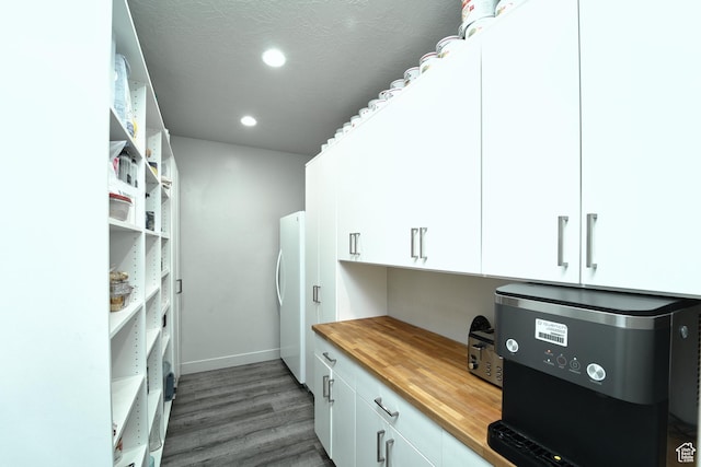 3410 W 2490 S, Hurricane, UT 84737 - kitchen featuring butcher block counters, wood finished floors, white cabinets, freestanding refrigerator, and open shelves