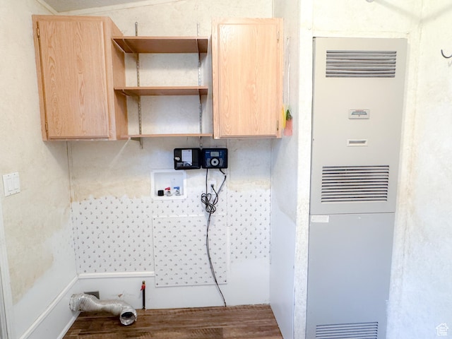912 S W Redview Dr, Monroe, UT 84754 - laundry area featuring a heating unit, cabinet space, and wood finished floors