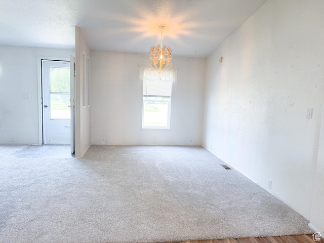 912 S W Redview Dr, Monroe, UT 84754 - empty room with a chandelier and carpet flooring